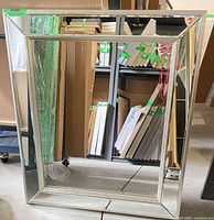 Front view of rectangular mirror showing mirrored frame and central reflective surface
