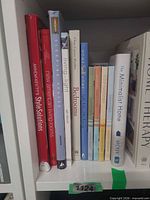 Shelf view showing all 11 books with visible titles and spines