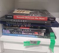 Stacked view of all six hardcover books showing titles and spines