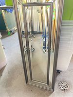 Full view of the narrow rectangular mirror
