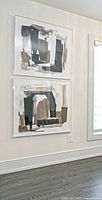 Both canvases mounted on wall showing overall appearance