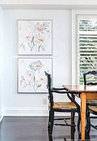 Both framed canvas art pieces mounted on wall, showing size and style
