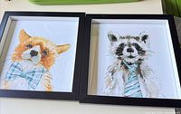 Both framed prints side by side