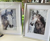 Both framed horse portraits side by side