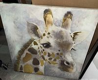 Square canvas featuring giraffe portrait with gold accents