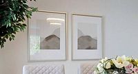 Pair of framed Cloud Kiss prints hanging side by side