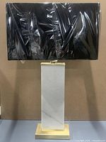 Lamp front view with shade wrapped in plastic