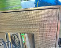 Close-up of textured champagne frame corner and mirror glass