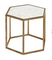 Full view of hexagonal accent table showing gold frame and antiqued glass top