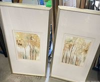Both framed prints leaning side by side showing overall design and size
