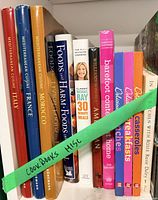 Shelf view showing full set of cookbooks left to right