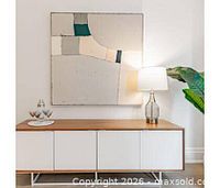 Canvas displayed on credenza, showing overall artwork and framing