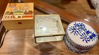 Three boxes closed: painted wood, gold-tone mirrored, round embroidered