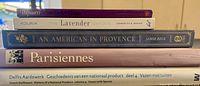 Stack of five arts-related illustrated books showing spines