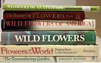 Stack of six illustrated flower books showing spines