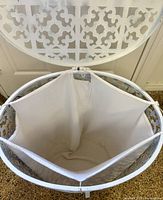 Open hamper showing removable fabric liner attached inside
