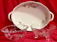 Porcelain serving bowl with floral decoration; two etched glass bowls