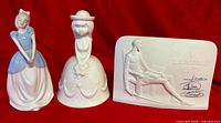 Three porcelain pieces: Lladró plaque, girl figurine, and bell