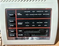 Front view showing control panel with sound options and sliders