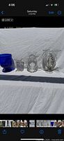 Four vases lined up on white background
