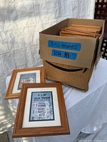 Box of oak wood 8" x 10" frames, two frames displayed outside box
