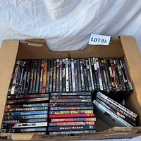 Overview of open box showing two rows of upright DVDs and additional stacked titles