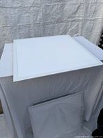 Top view of one LED panel on table showing square frame and diffuser