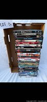 Full stack of DVDs in cardboard tray, showing spines