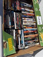 Full banana box filled with DVD cases