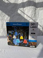 Front of sealed Atomi Smart 36ft LED Color String Lights box