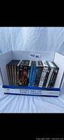 Front view of all DVD cases standing upright in box