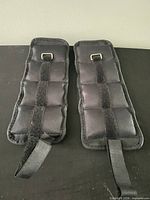 Top view of both ankle weights showing Velcro straps and D-rings