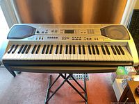 Top view of Casio LK-90TV keyboard on X-style stand