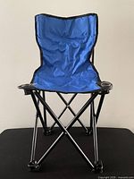 Front view of blue child folding camping chair showing cup holder and frame