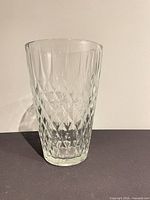 Front view of clear diamond-cut glass vase