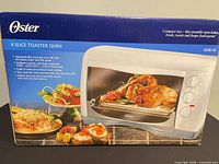 Retail box showing Oster 4-slice toaster oven model 6235-33