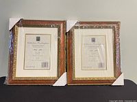 Front view of both Pelmar Buckingham frames showing gold gilt trim, brown body, mats and size labels