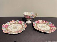 Full set showing teacup and two saucers