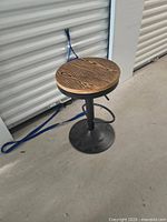 Full view of bar stool showing seat, column and base
