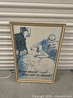 Front view of framed WWII propaganda poster