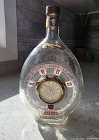 Full view of Luxardo glass bottle with Kaiser clock inside
