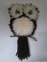 Full front view of owl wall hanging showing overall appearance and branch perch