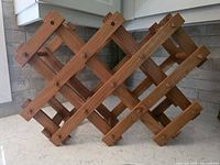 Overall view of freestanding wooden lattice wine rack