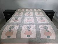 Quilt spread on bed showing full pattern and block layout