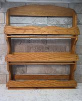 Front view of solid oak three-tier spice rack