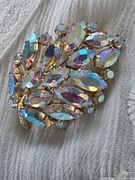 Full view of brooch showing leaf shape and rhinestones