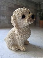 Full left-front view of ceramic dog music box