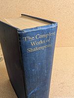Book spine showing title The Complete Works of Shakespeare, blue cloth with wear
