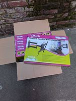 Open carton containing five Rocelco VMDA mount boxes