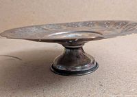 side view showing pedestal base and tarnish